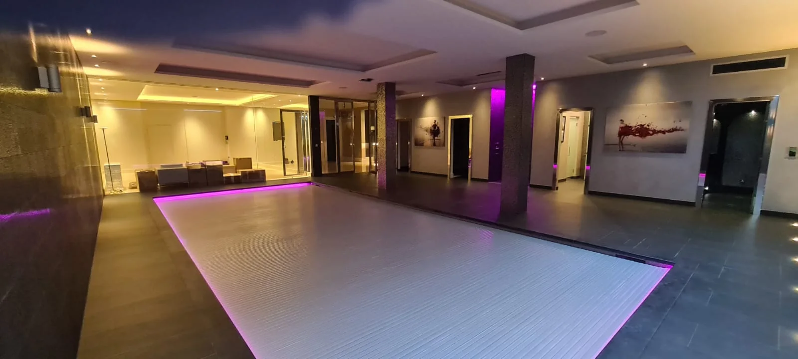 Lower-ground leisure suite with lit pool surround