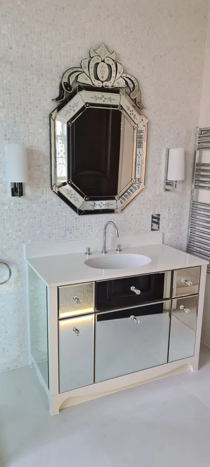 Mirrored vanity unit with a Venetian mirror and stone basin
