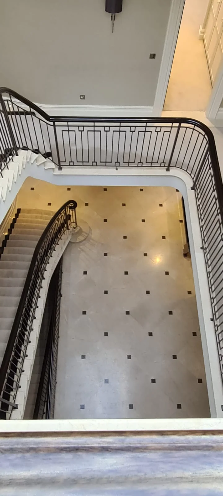 View down the stairwell to the marble entrance hall