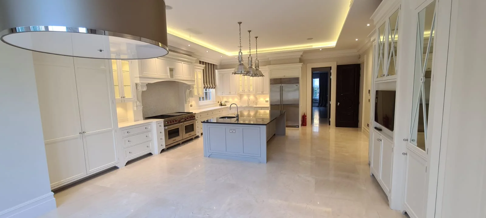 Refurbished kitchen with bespoke cabinetry and a central island, St John's Wood