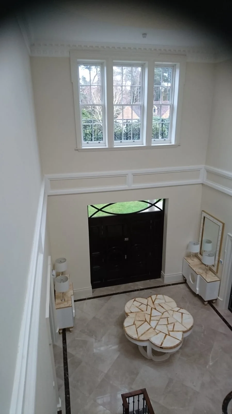 Double-height entrance hall seen from the galleried landing